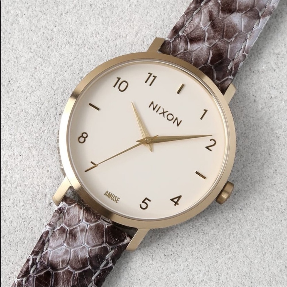 Nixon women’s snake print leather band watch
